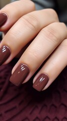 Beautiful, shiny brown, nude, glossy manicure and vertical photo
