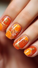 Beautiful design of orange summer manicure on fingers with a pattern of oranges, stickers, vertical photo