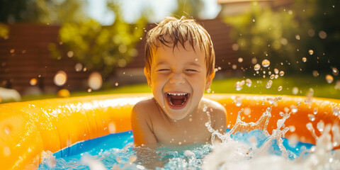 Cute little boy having fun splashing in inflatable swimming pool outdoors on sunny summer day. Active leisure for kids in summer.