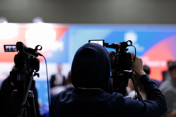 TV news camera operator broadcasting live event