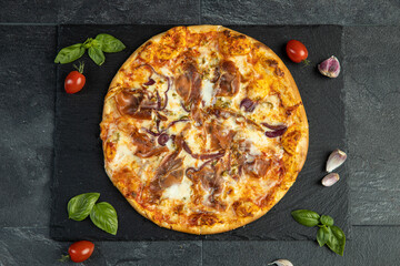 pizza menu on dark plate with stone texture