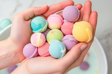 hands holding an assortment of colorful bath bombs