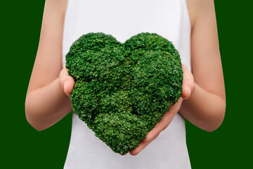 Green Vegetables for Healthy Food. Broccoli Heart in Hands. International World Vegan Day. Copy Space.