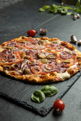 pizza menu on dark plate with stone texture