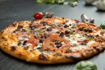 pizza menu on dark plate with stone texture