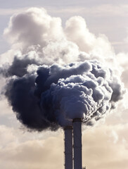 Smoking chimney pipes of a electro power station plant  causing air pollution. - 735978356