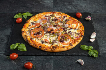 pizza menu on dark plate with stone texture