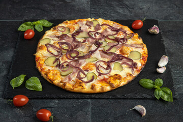 pizza menu on dark plate with stone texture