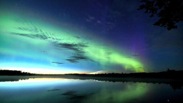 Amazing view of green aurora borealis shining in the night sky