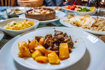Fried liver cubes with potatoes. Tradinational Turkish Food
