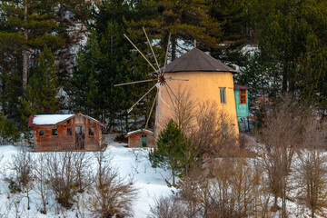 Beautiful view of windmills around Lake Çubuk, located in Bolu - Goynuk district of Turkey. Photo of mills in snowy weather in winter.