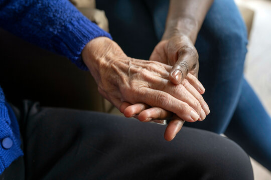 Helper caring for elderly lady