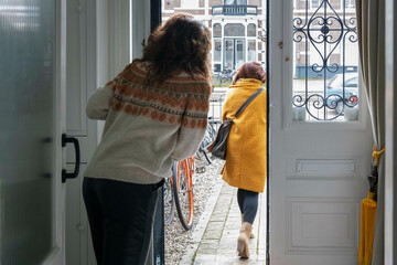 Saying goodbye to Mother in law, waving from the front door