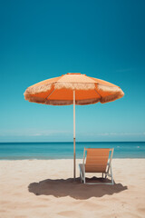 empty sunbed on the beach with umbrella