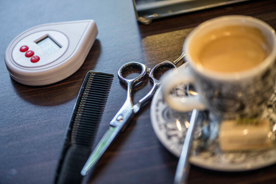Close up still life of hair dressers scissors and comb