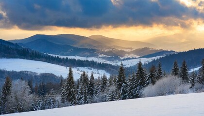 Fototapeta na wymiar carpathian countryside scenenry in winter season at sunrise rural landscape with snow covered fields on the forested hills in shade of a mountains beneath a cloudy sky