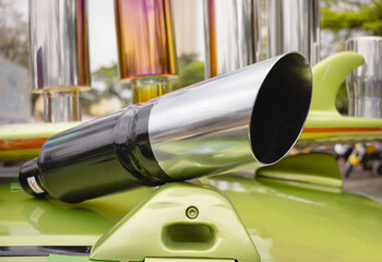 Sports car exhaust on display. Removes gases that form in the engine combustion chamber - obrazy, fototapety, plakaty