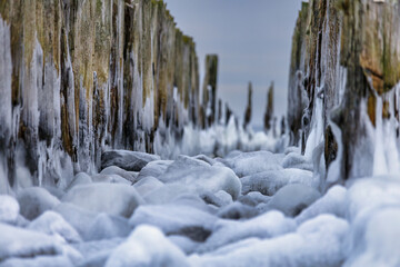Frozen Baltic Sea beach in Babie Doły at sunset, Gdynia. Poland - obrazy, fototapety, plakaty