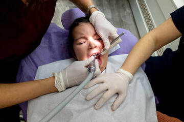 Little girl goes to the dentist for dental health - 736021903