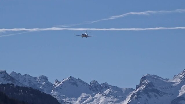 High End Business Jet Final Approach mountains snow covered vacation holiday landing arrival arriving