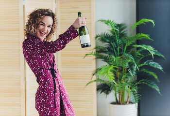 Woman on Hotel Bed Covering Self With Sheet.
