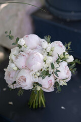 Beauty wedding bouquet made from light pink peonies. Wedding floristic
