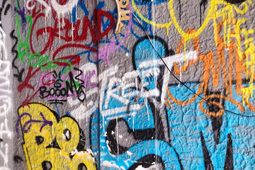 graffitied wall texture on the street - 736029784