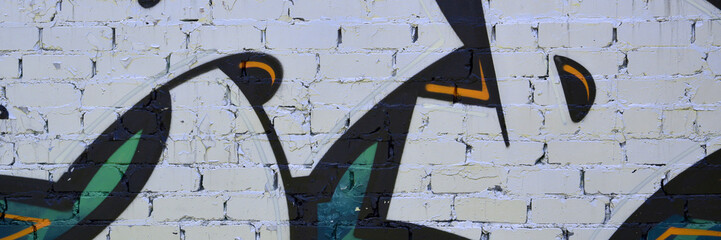 Colorful background of graffiti painting artwork with bright aerosol outlines on wall. Old school...