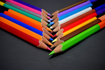 neatly arranged color pencils