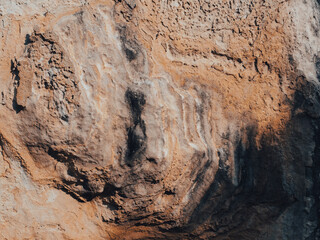 Brown cave wall stone texture for nature background.
