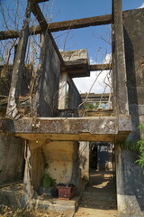 Ruins of an old house with a through passage. Destruction.