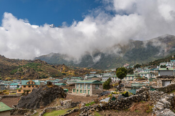 Traditional Nepalese Village in Himalayan mountains. Khumjung, Sagarmatha, Nepal. View of Houses and mountains in clouds during EBC Everest base Camp or Three passes trek in Nepal. Acclimatization day