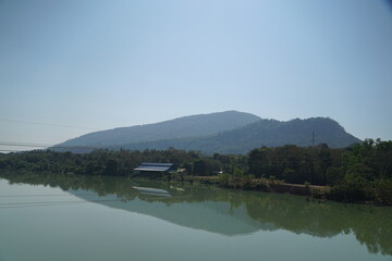 The lake reflects the beautiful mountains and villages.