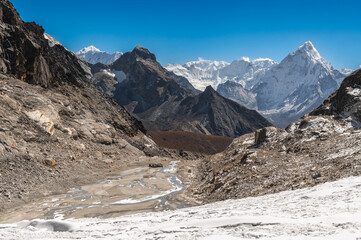 Mounts Baruntse, Chamlang and Ama Dablam from Cho La Pass during Everest Base Camp EBC or Three Passes trekking in Khumjung, Nepal. Highest mountains in the world. Snowy alpine landscape