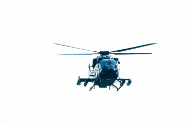 Close-up of helicopter flying on isolated white background