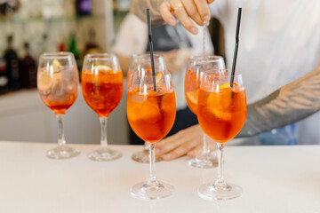 Bartender Preparing a Variety of Drinks