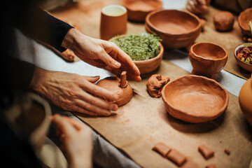 handmade clay potter making with hands