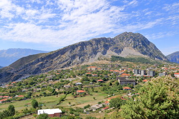 Fototapeta na wymiar Photo of the village of Leskovik , Korce Albania. this village is positioned next to a mountain with lots of cliffs