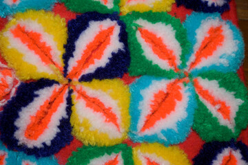 Detail embroidered with colorful wool with horizontal abstract shapes