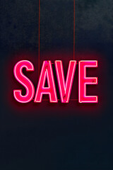 Neon word SAVE on dark shabby wall