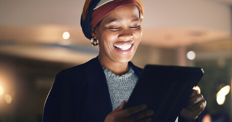 Business, happy black woman and tablet at night in office to search online report, scroll...