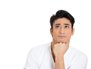 Closeup portrait of young man thinking daydreaming deeply about something with hand on chin looking upwards, isolated on white background  - 736107580