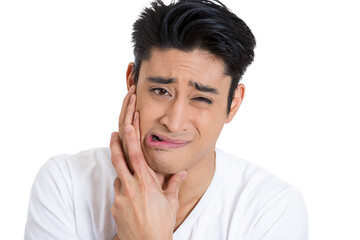 Closeup portrait of guy wearing blue shirt with tooth ache isolated on white background - 736107745