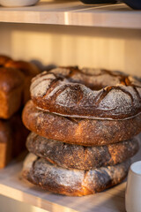 Assortments of bread, freshly baked on a shelf. Bakery goods. 