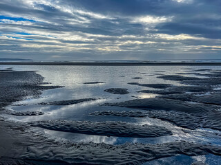 View of the beach during low tide. Selective focus