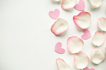 White rose petals on white background. Valentine's Day concept