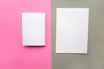 Two white mockup blanks on gray and pink geometric paper background texture