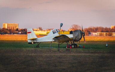 Small plane on a airport with sunset light. Light plane.