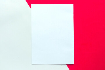 White mockup blank on red and white geometric paper background