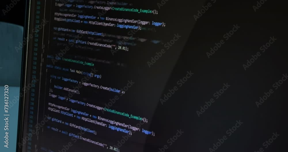 Wall mural hacker programmer writes code on notebook computer, technology and cybersecurity